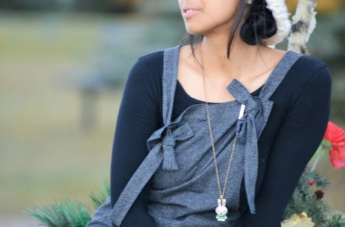 Thanh wearing a refashioned dress from pants, as well as knee high boots, black top and a hat.